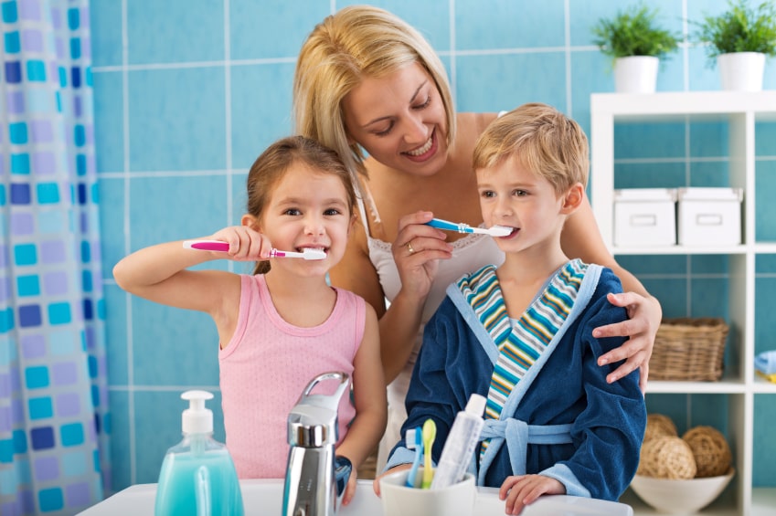 mom-brushing-kids-teeth-min.jpg
